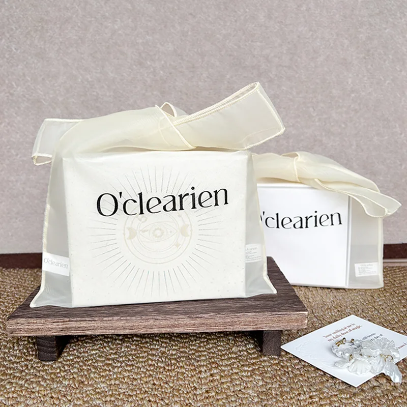 Sheer organza gift bag construction and ribbon presentation detail